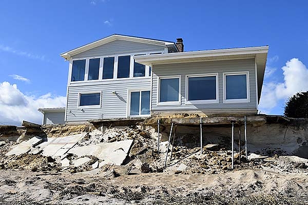 damaged house on a beach